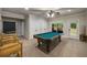 Spacious game room featuring a pool table, neutral carpet, and an exterior entrance at 4415 Saint Andrews Crest Dr, Cumming, GA 30040