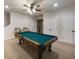 Large game room featuring a pool table, ceiling fan and access to the basement at 4415 Saint Andrews Crest Dr, Cumming, GA 30040
