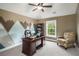 Home office with a mountain mural, a desk, a bookshelf, and a window at 4415 Saint Andrews Crest Dr, Cumming, GA 30040
