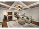 Open concept living room featuring hardwood floors and access to kitchen at 4415 Saint Andrews Crest Dr, Cumming, GA 30040