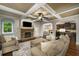 Comfortable living room featuring a stone fireplace and coffered ceilings at 4415 Saint Andrews Crest Dr, Cumming, GA 30040