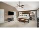 Spacious main bedroom features a ceiling fan, carpet, and large windows for natural light at 4415 Saint Andrews Crest Dr, Cumming, GA 30040