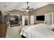 Spacious main bedroom features a ceiling fan, carpet, and attached study/office space at 4415 Saint Andrews Crest Dr, Cumming, GA 30040