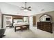 Spacious main bedroom featuring a ceiling fan, carpet, and large windows for natural light at 4415 Saint Andrews Crest Dr, Cumming, GA 30040