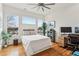 Bright bedroom features hardwood floors, three windows, and a ceiling fan at 522 Boulevard Ne Pl, Atlanta, GA 30308