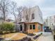 Contemporary home with mixed materials, professionally landscaped front yard, and a welcoming path leading to the entrance at 522 Boulevard Ne Pl, Atlanta, GA 30308