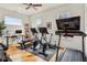 This home gym features exercise bikes, free weights, and a weight bench at 522 Boulevard Ne Pl, Atlanta, GA 30308