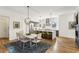 Open-concept kitchen and dining area featuring modern appliances and stylish pendant lighting at 522 Boulevard Ne Pl, Atlanta, GA 30308