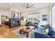 Stylish living room featuring a modern fireplace, hardwood floors, and comfortable seating arrangement at 522 Boulevard Ne Pl, Atlanta, GA 30308