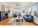 Stylish living room featuring a modern fireplace, hardwood floors, and comfortable seating arrangement at 522 Boulevard Ne Pl, Atlanta, GA 30308