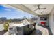 This outdoor kitchen features a grill, bar, and ceiling fans at 522 Boulevard Ne Pl, Atlanta, GA 30308