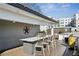 Outdoor kitchen with built-in grill and bar seating offers stunning views at 522 Boulevard Ne Pl, Atlanta, GA 30308