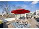This rooftop deck features an outdoor kitchen, a dining area, and neighborhood views at 522 Boulevard Ne Pl, Atlanta, GA 30308