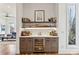 Elegant wet bar features custom cabinetry, open shelving, and a built-in wine refrigerator at 522 Boulevard Ne Pl, Atlanta, GA 30308