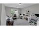 This carpeted bedroom includes a futon sofa, a desk and chair set, and a window allowing natural light at 6820 Gallant Se Cir # 2, Mableton, GA 30126