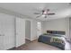 Well-lit bedroom with ceiling fan, carpeted floor, and neutral walls offering serene retreat at 6820 Gallant Se Cir # 2, Mableton, GA 30126
