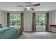 Bedroom with a ceiling fan, windows, neutral walls, and hardwood floors at 6820 Gallant Se Cir # 2, Mableton, GA 30126