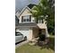 Charming two-story home featuring an attached garage, well-manicured lawn and simple landscaping at 6820 Gallant Se Cir # 2, Mableton, GA 30126