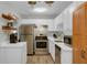 Modern kitchen with stainless steel appliances, bright white cabinetry, and ample counter space at 6820 Gallant Se Cir # 2, Mableton, GA 30126