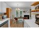 Kitchen and dining area with wood cabinets, stainless steel appliances, and a fireplace at 6820 Gallant Se Cir # 2, Mableton, GA 30126