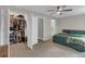 The main bedroom includes a walk-in closet, ceiling fan, neutral walls and a view of the bath at 6820 Gallant Se Cir # 2, Mableton, GA 30126