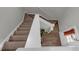 Carpeted staircase with white railing leading to the upper level of the home at 6820 Gallant Se Cir # 2, Mableton, GA 30126