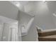 Carpeted staircase featuring neutral walls, white railing, and access to the upper level at 6820 Gallant Se Cir # 2, Mableton, GA 30126
