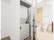 Bright bathroom featuring a tub with tiled walls and a convenient washer and dryer at 855 Peachtree Ne St # 2001, Atlanta, GA 30308