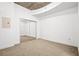 This bedroom includes carpet and a closet with mirrored sliding doors at 855 Peachtree Ne St # 2001, Atlanta, GA 30308