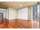 Bright bedroom with hardwood floors and floor-to-ceiling windows providing stunning city views at 855 Peachtree Ne St # 2001, Atlanta, GA 30308