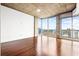 Bright bedroom with hardwood floors and large windows for ample natural light at 855 Peachtree Ne St # 2001, Atlanta, GA 30308
