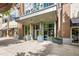 View of the building entrance showcasing glass doors and modern architecture at 855 Peachtree Ne St # 2001, Atlanta, GA 30308