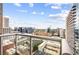 Gorgeous city view from private balcony with a railing, capturing the skyline and surrounding buildings at 855 Peachtree Ne St # 2001, Atlanta, GA 30308