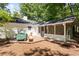 Home's backyard featuring a deck, a screened in porch, and mature trees at 121 Danielle Ct, Villa Rica, GA 30180