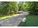 View of house featuring a long driveway and lush green landscaping at 121 Danielle Ct, Villa Rica, GA 30180