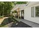 Inviting covered porch with decorative plants and comfortable seating at 121 Danielle Ct, Villa Rica, GA 30180