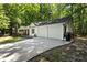 Home exterior with a two-car garage and a spacious driveway at 121 Danielle Ct, Villa Rica, GA 30180