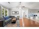 Cozy living room with hardwood floors, a ceiling fan, and a comfortable couch at 121 Danielle Ct, Villa Rica, GA 30180