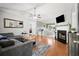 Open-concept living room with hardwood floors, a fireplace, and a Gathering room at 121 Danielle Ct, Villa Rica, GA 30180