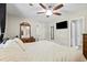 Spacious main bedroom is enhanced with a ceiling fan and a connecting bathroom at 121 Danielle Ct, Villa Rica, GA 30180