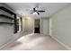 Spacious basement with neutral carpet, a ceiling fan and a view of the stairwell at 1741 Branch View Dr, Marietta, GA 30062