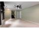 Spacious basement with neutral carpet, a ceiling fan and a view of the stairwell at 1741 Branch View Dr, Marietta, GA 30062