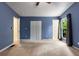 Spacious carpeted bedroom with natural light, blue walls, closet and neutral carpeting at 1741 Branch View Dr, Marietta, GA 30062