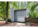 Exterior view of home with light blue siding, a single car garage, and a driveway at 1741 Branch View Dr, Marietta, GA 30062