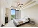This cozy bedroom has a large window overlooking trees, and a tray ceiling with accent lighting at 2233 Peachtree Ne Rd # 903, Atlanta, GA 30309