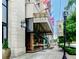 Building entrance featuring a grand glass entrance and well-manicured landscaping, offering an upscale ambiance at 2233 Peachtree Ne Rd # 903, Atlanta, GA 30309