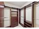 This walk-in closet features custom shelving and hanging rods for optimal organization and storage solutions at 2233 Peachtree Ne Rd # 903, Atlanta, GA 30309