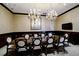 Conference room featuring a large table with comfortable chairs, chandeliers, and a mounted TV at 2233 Peachtree Ne Rd # 903, Atlanta, GA 30309