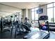 Bright gym with treadmills, weights, fitness equipment, and large windows allowing ample natural light at 2233 Peachtree Ne Rd # 903, Atlanta, GA 30309
