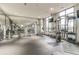 Spacious gym features various fitness machines, mirrored walls, and multiple large windows for ample lighting at 2233 Peachtree Ne Rd # 903, Atlanta, GA 30309